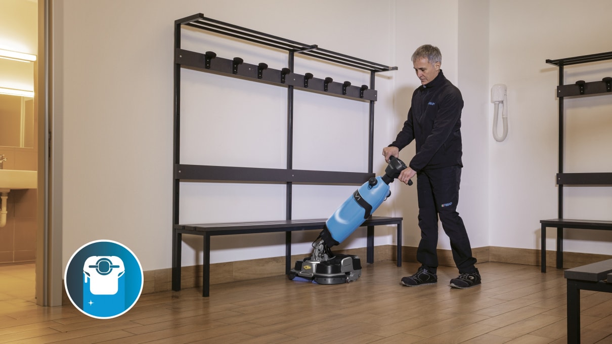 Fimap V1 scrubber dryer cleaning a changing room corridor at a leisure facility